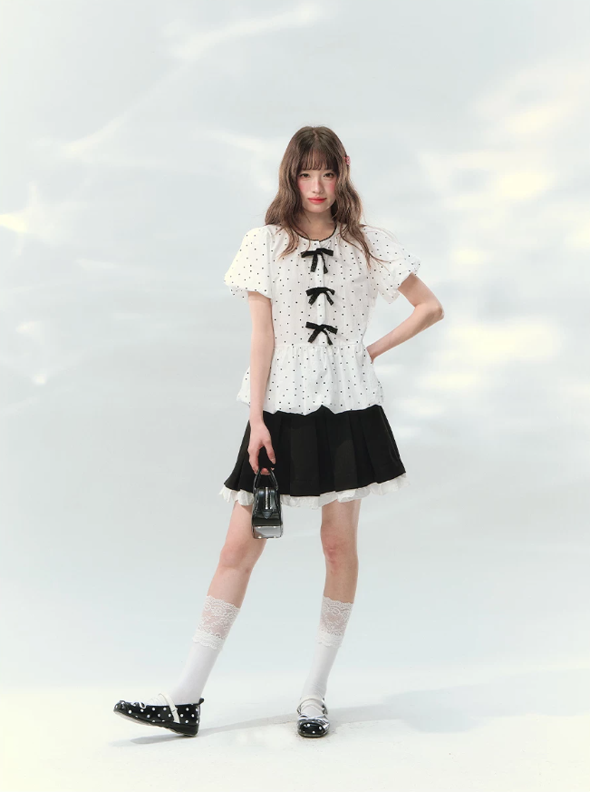 “Polka Soufflé” White Polka Dot Bow Peplum Blouse