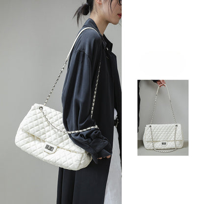 "First Class Arrival" Black Quilted Chain Tote Bag