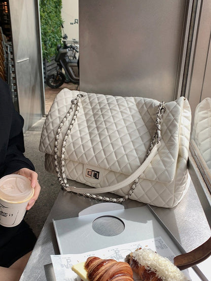 "First Class Arrival" Black Quilted Chain Tote Bag