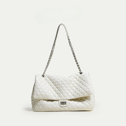 "First Class Arrival" Black Quilted Chain Tote Bag