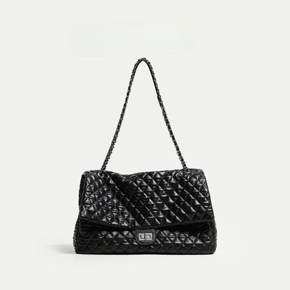 "First Class Arrival" Black Quilted Chain Tote Bag