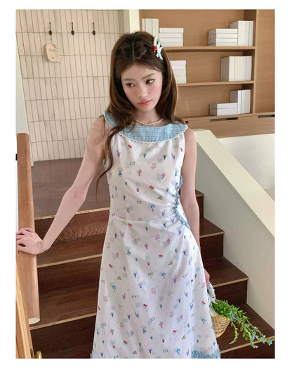 “Blue Meadow Letter” Misty Blue Floral Maxi Dress