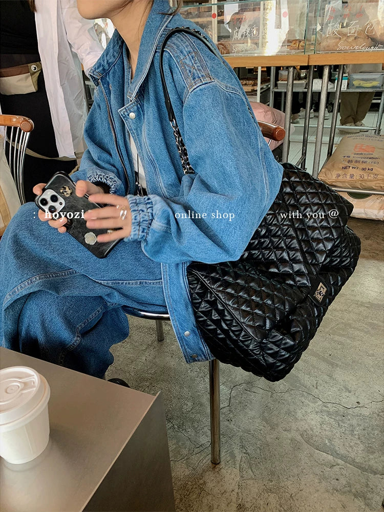 "First Class Arrival" Black Quilted Chain Tote Bag