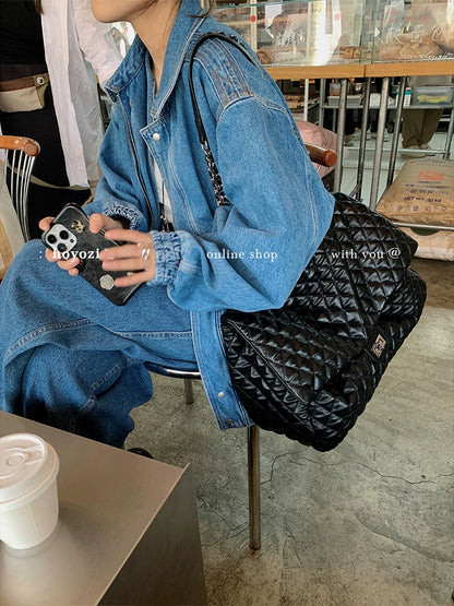 "First Class Arrival" Black Quilted Chain Tote Bag