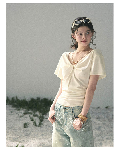 “White Between Breaths” Ivory Twist V-Neck Top