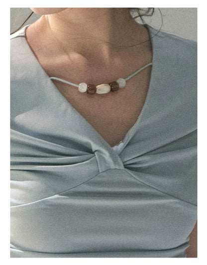 “Sheer Spring Whisper” Moonlight Blue Twist V-Neck Top
