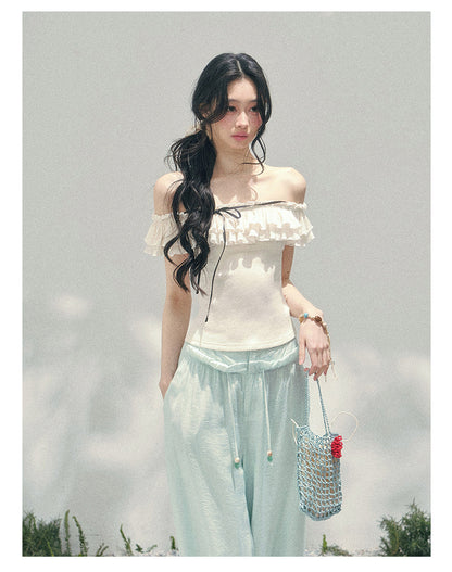 “White Pearlight” Ivory Off-Shoulder Ruffle Tee