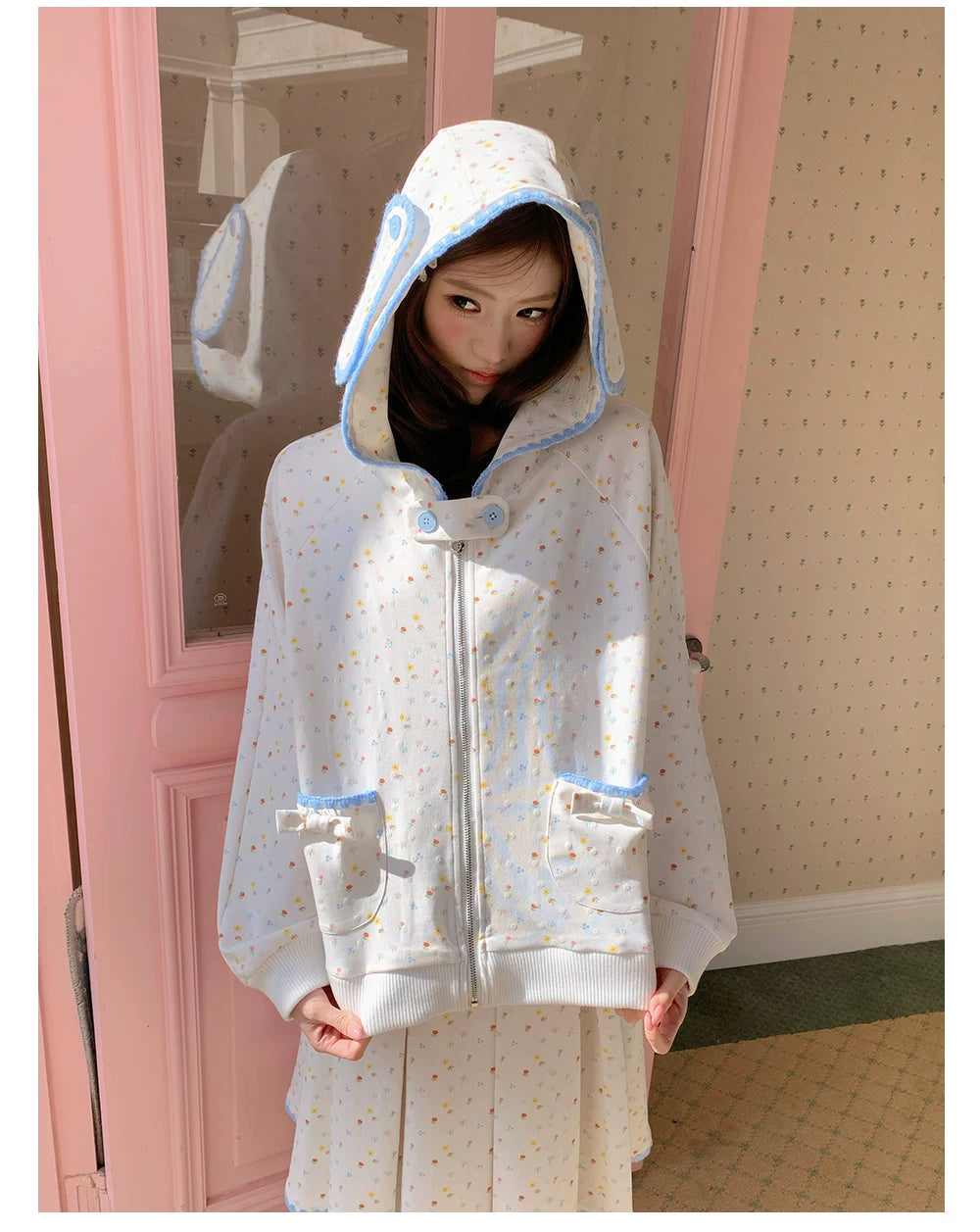 “Snow Bunny Reverie” Ivory Rabbit Ear Hoodie & Floral Pleated Mini Skirt