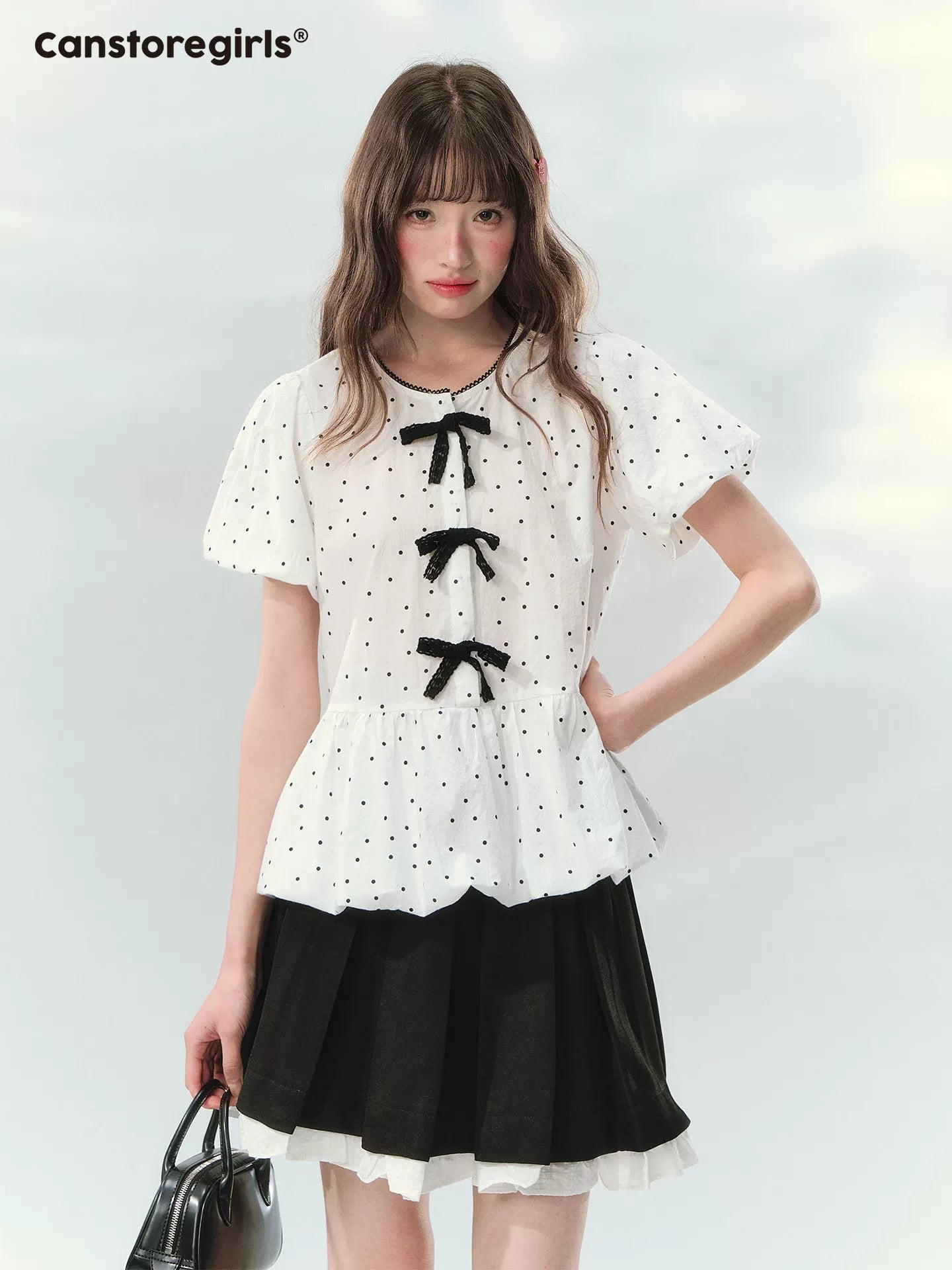 “Polka Soufflé” White Polka Dot Bow Peplum Blouse