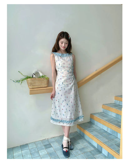 “Blue Meadow Letter” Misty Blue Floral Maxi Dress