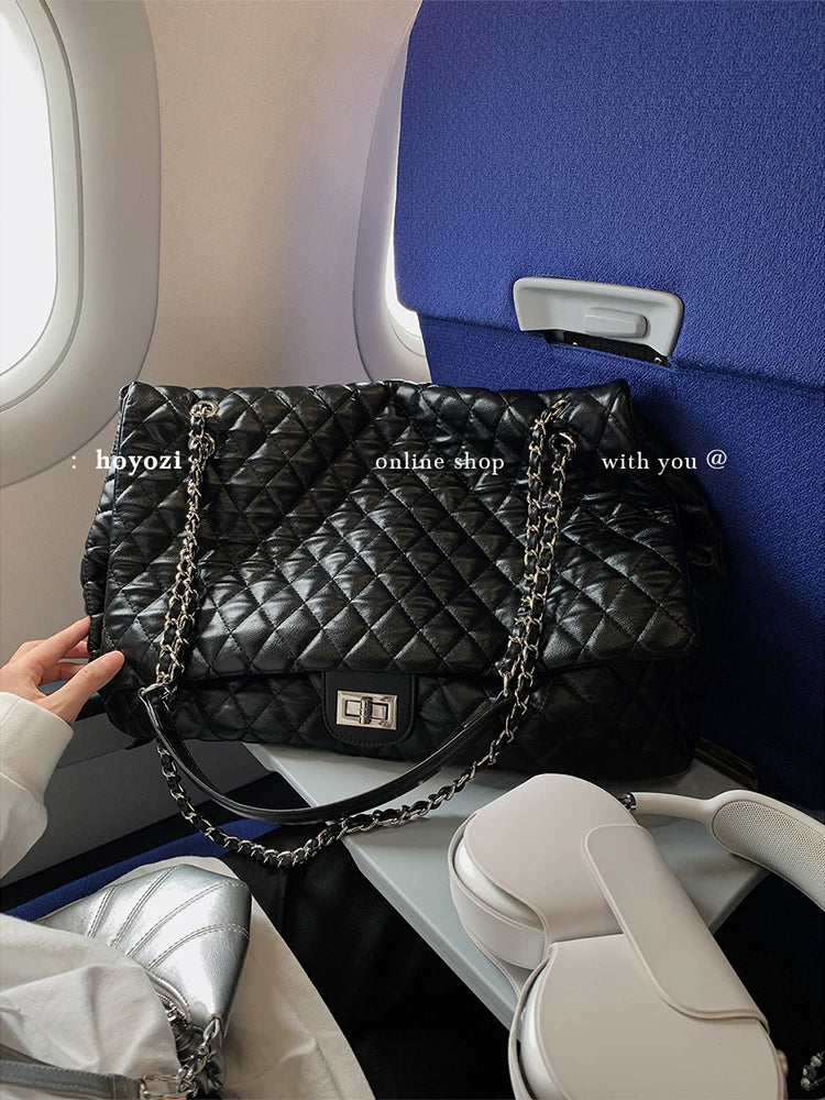 "First Class Arrival" Black Quilted Chain Tote Bag