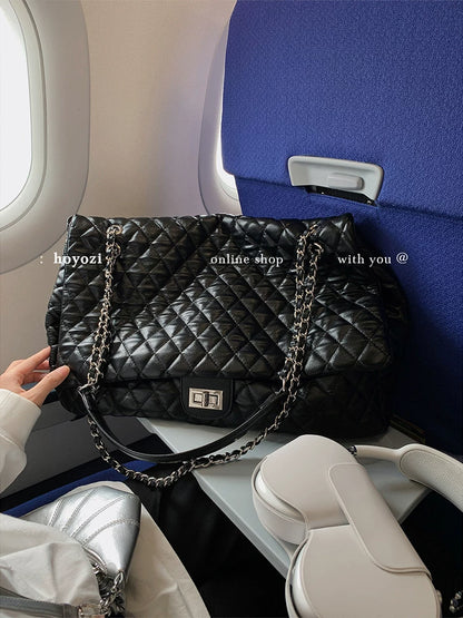 "First Class Arrival" Black Quilted Chain Tote Bag