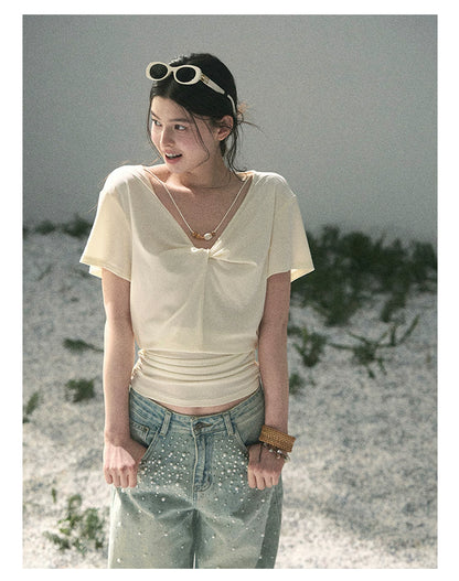 “White Between Breaths” Ivory Twist V-Neck Top