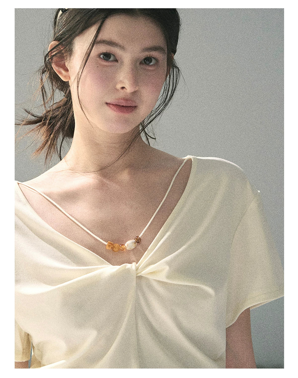 “White Between Breaths” Ivory Twist V-Neck Top