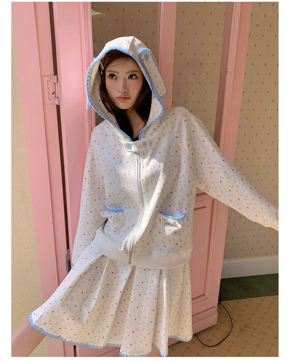 “Snow Bunny Reverie” Ivory Rabbit Ear Hoodie & Floral Pleated Mini Skirt