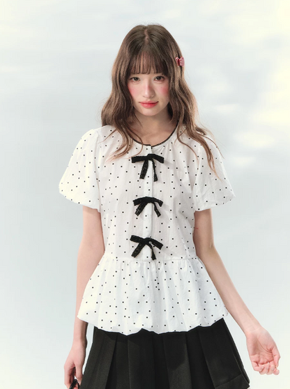 “Polka Soufflé” White Polka Dot Bow Peplum Blouse
