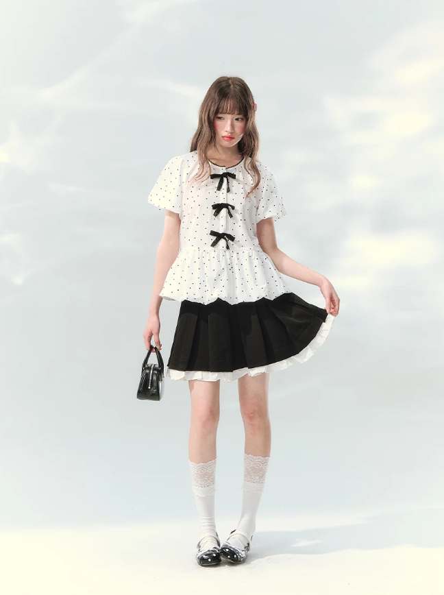 “Polka Soufflé” White Polka Dot Bow Peplum Blouse