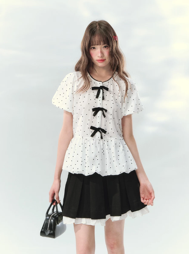 “Polka Soufflé” White Polka Dot Bow Peplum Blouse