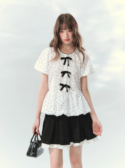 “Polka Soufflé” White Polka Dot Bow Peplum Blouse