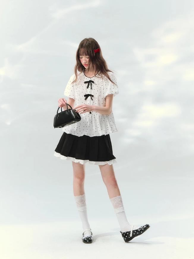 “Polka Soufflé” White Polka Dot Bow Peplum Blouse