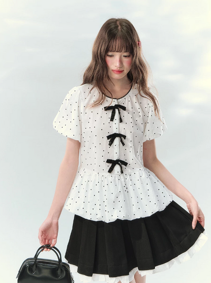 “Polka Soufflé” White Polka Dot Bow Peplum Blouse