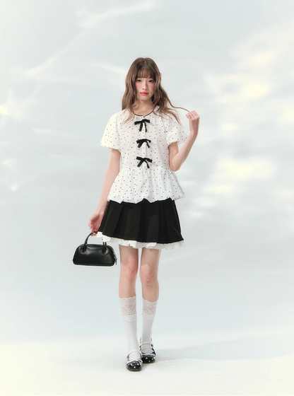 “Polka Soufflé” White Polka Dot Bow Peplum Blouse