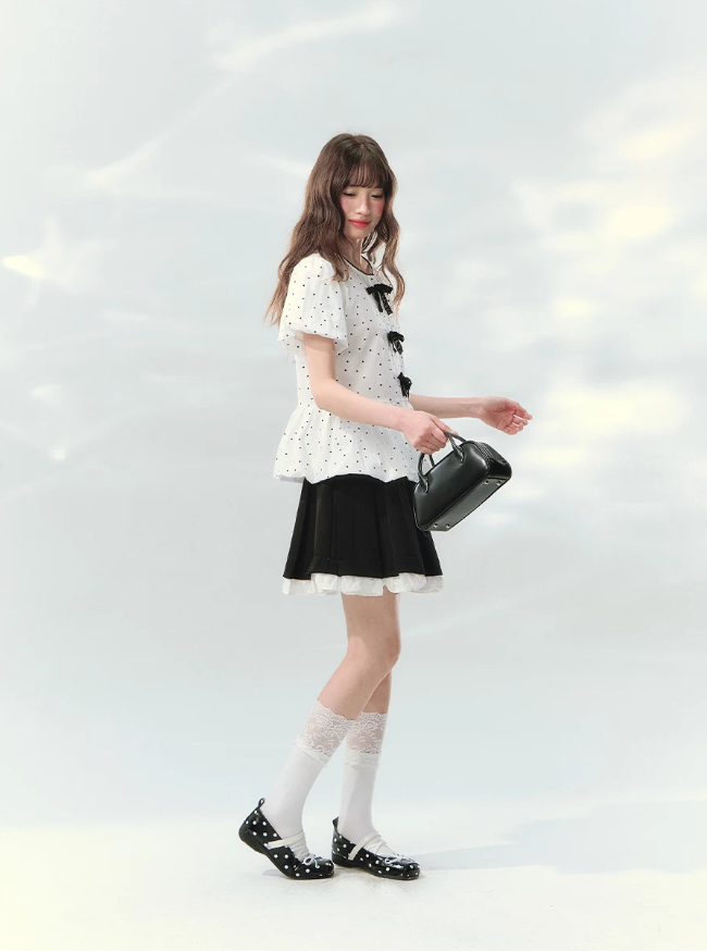 “Polka Soufflé” White Polka Dot Bow Peplum Blouse