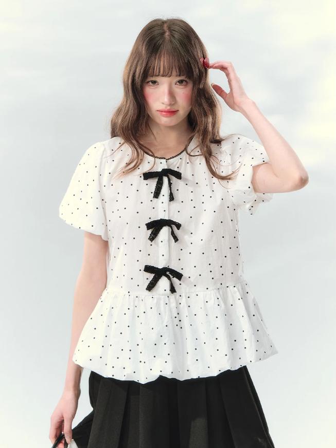 “Polka Soufflé” White Polka Dot Bow Peplum Blouse