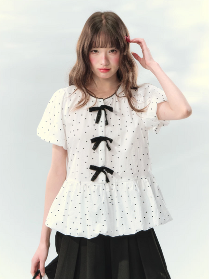 “Polka Soufflé” White Polka Dot Bow Peplum Blouse